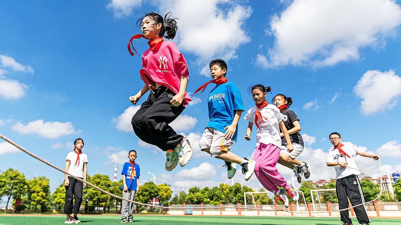 Students skip at the playground of a primary school in Haian, a city in China.