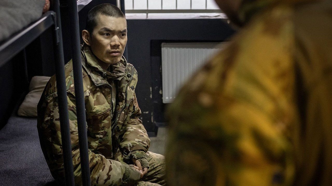 A soldier presented as Chinese detained by Ukrainian authorities at an undisclosed location in Ukraine
