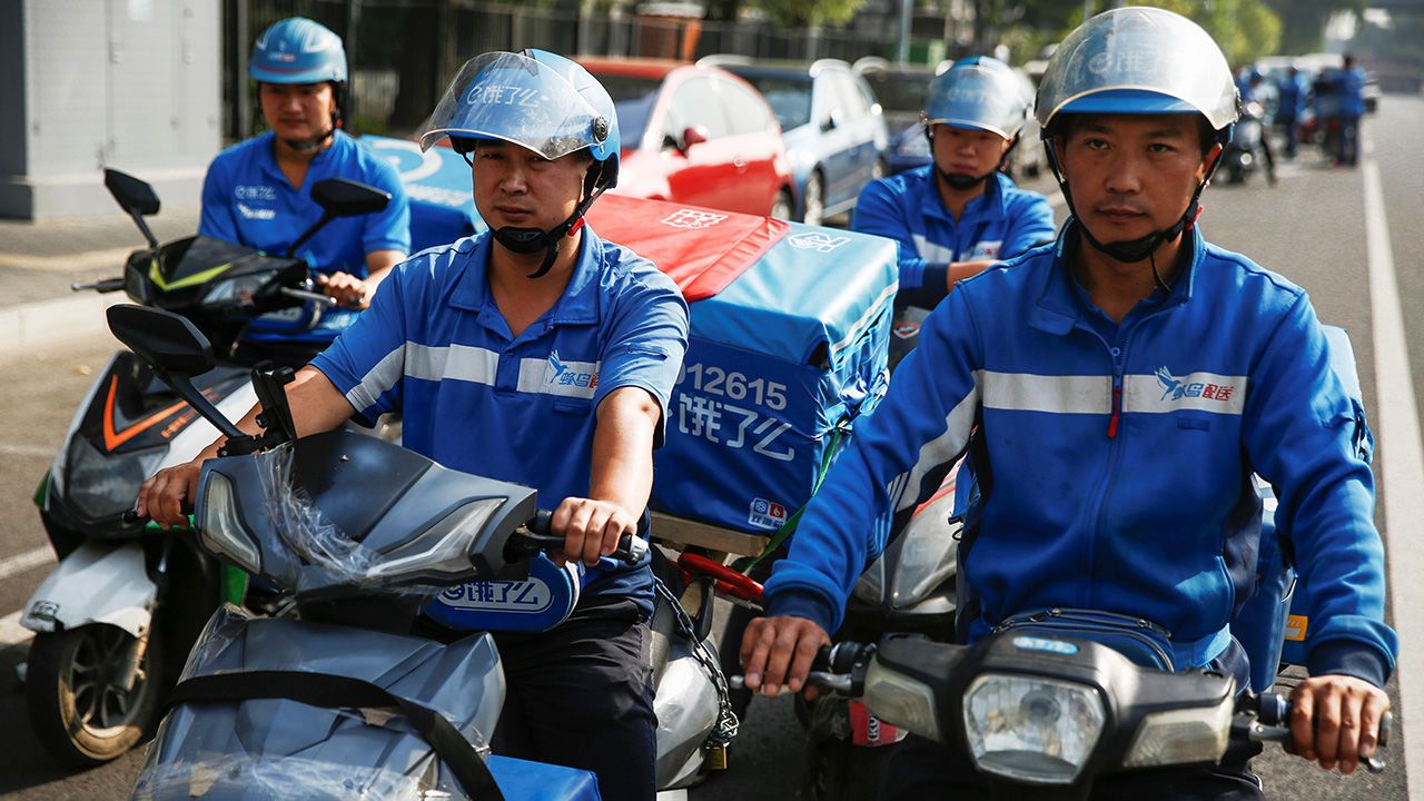 Food delivery drivers on their mopeds in Beijing, China