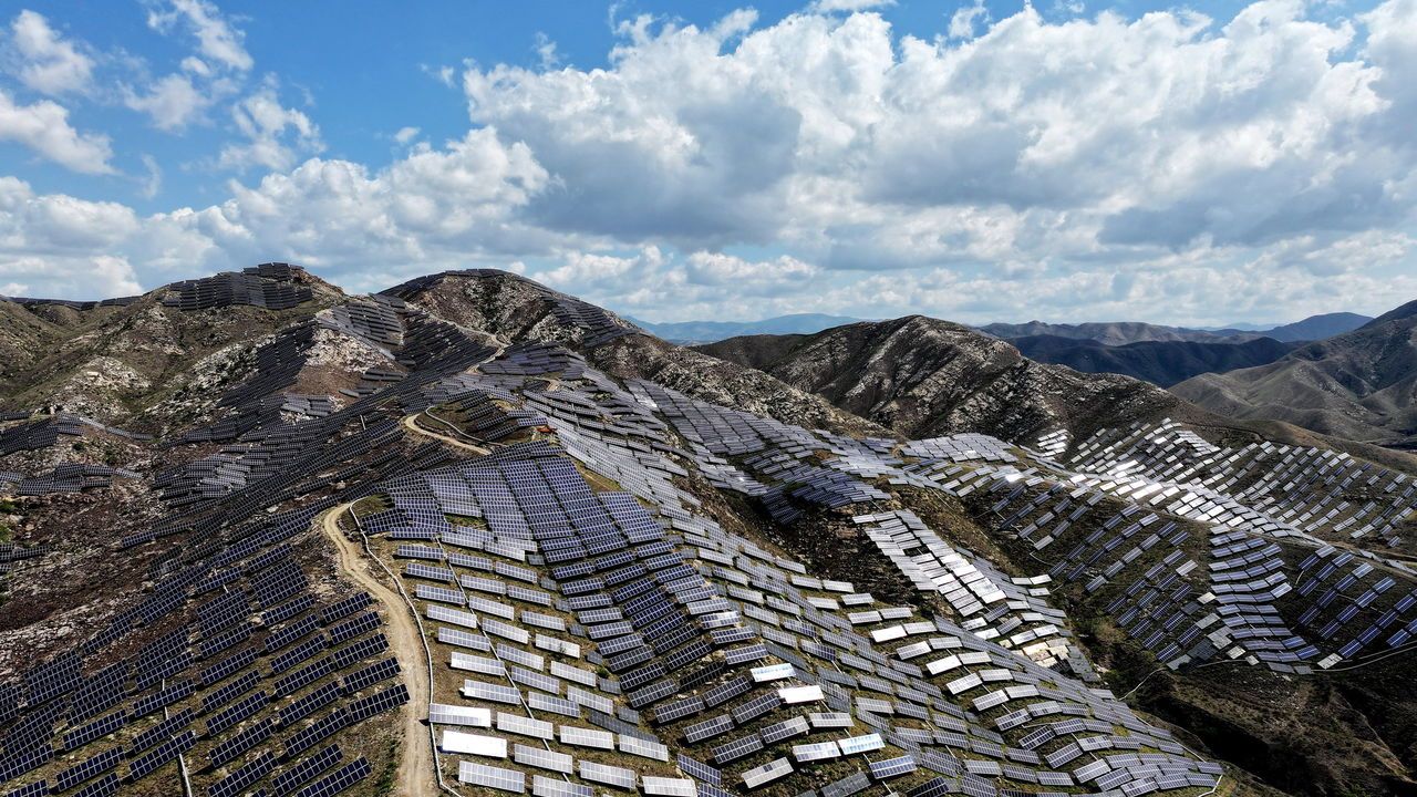 A photovoltaic power station is seen on the North Barren Mountain in Zhangjiakou, China