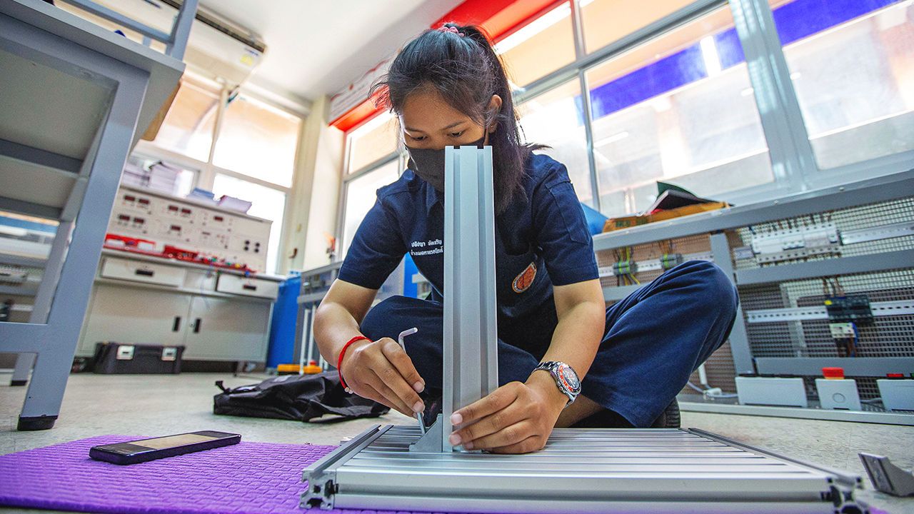 A student builds an installation system of automation production line at the Luban Workshop of Ayutthaya Technical College in Ayutthaya, Thailand