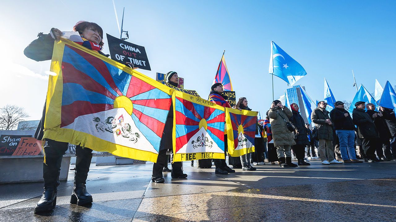 Tibetan and Uyghur activist stage a protest outside of the UN Offices in Geneva during the review of China’s rights record by the United Nations Human Rights Council,