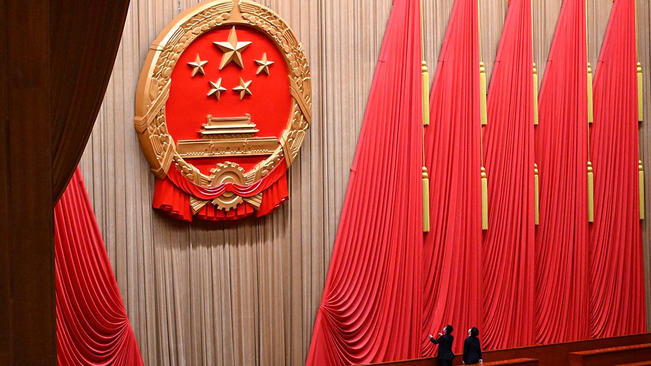 Two staff members prepare for the closing session of the 14th National People's Congress at the Great Hall of the People in Beijing, China on March 11th 2024