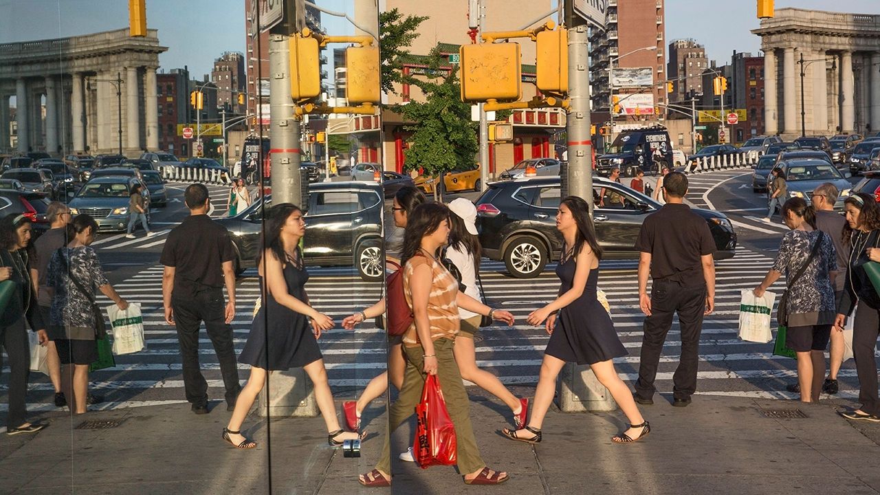 Pedestrians on Canal Street, Chinatown, New York City, USA in 2017