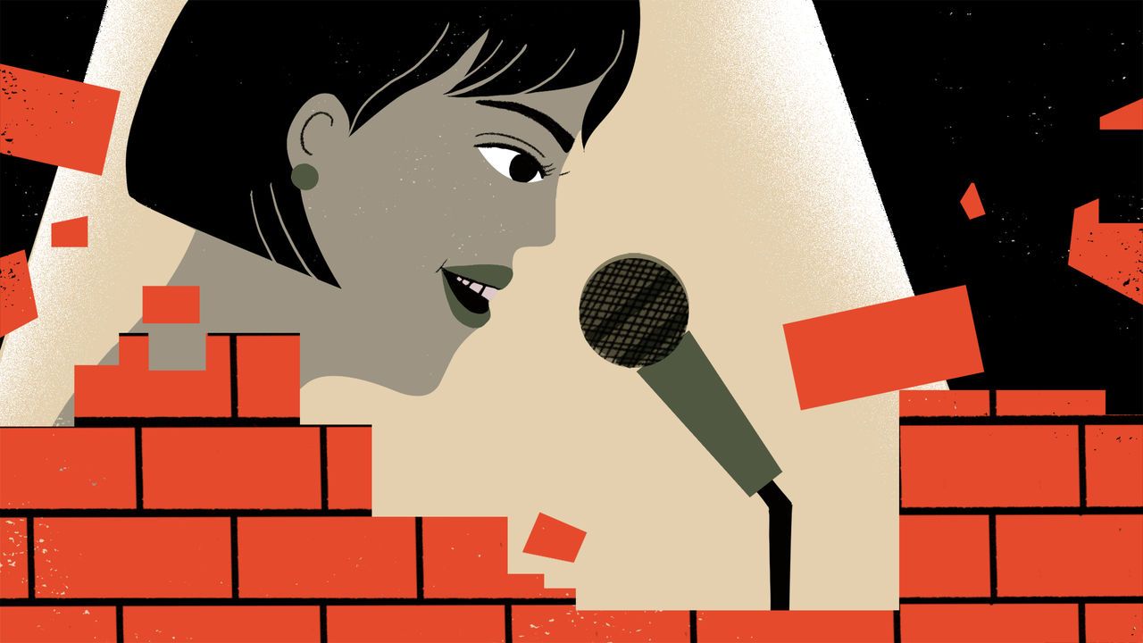 An illustration showing a woman's face under a spotlight. The woman is speaking into a microphone whilst a red brick wall is breaking down in front of her.