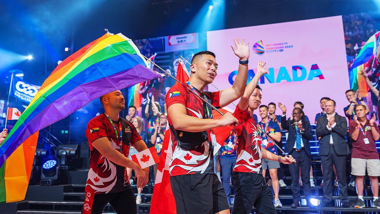 Participants wave during the opening ceremony of the Gay Games in Hong Kong