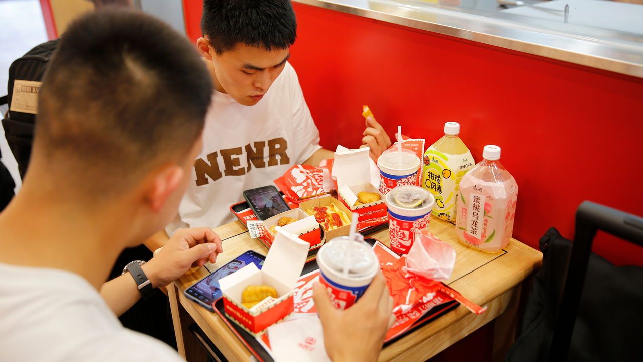 Two men eat at Tastien.